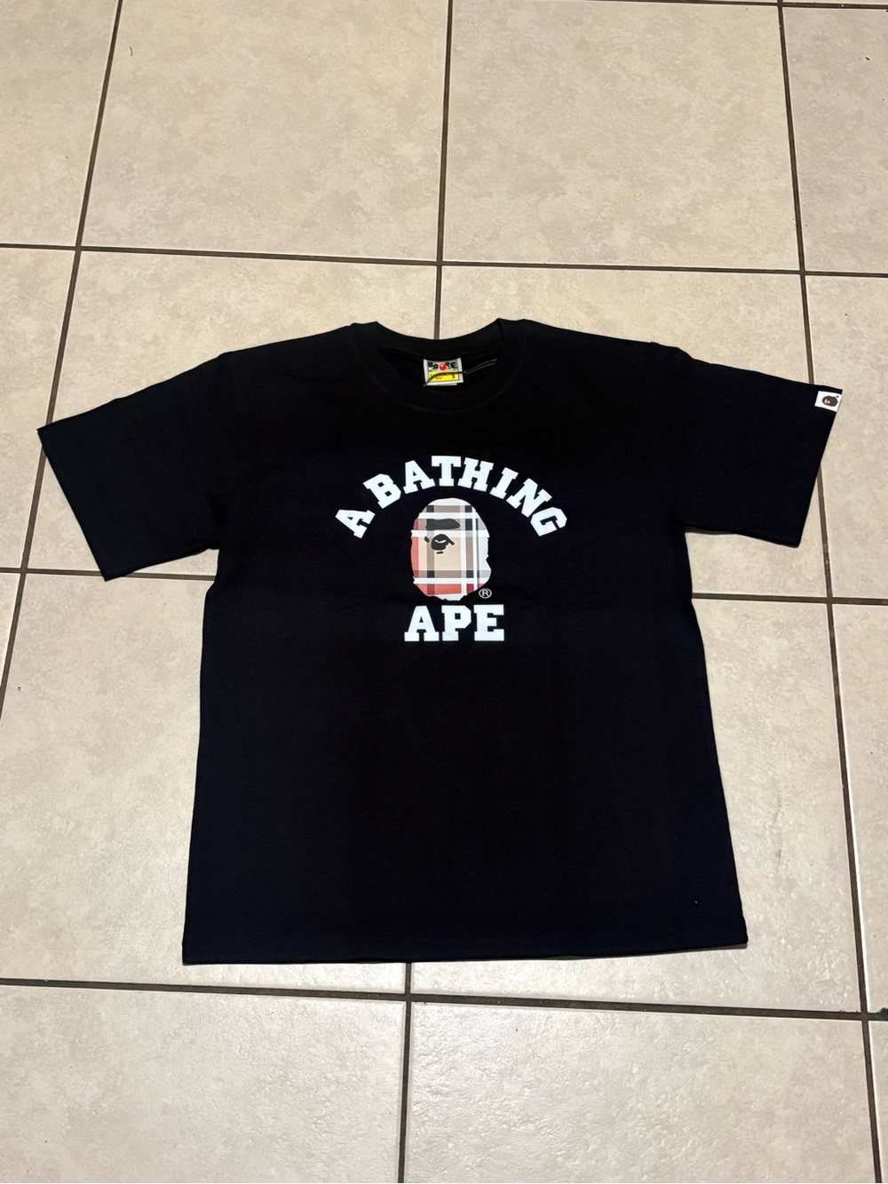Bape Black Tee with Burberry-Style Camo Logo